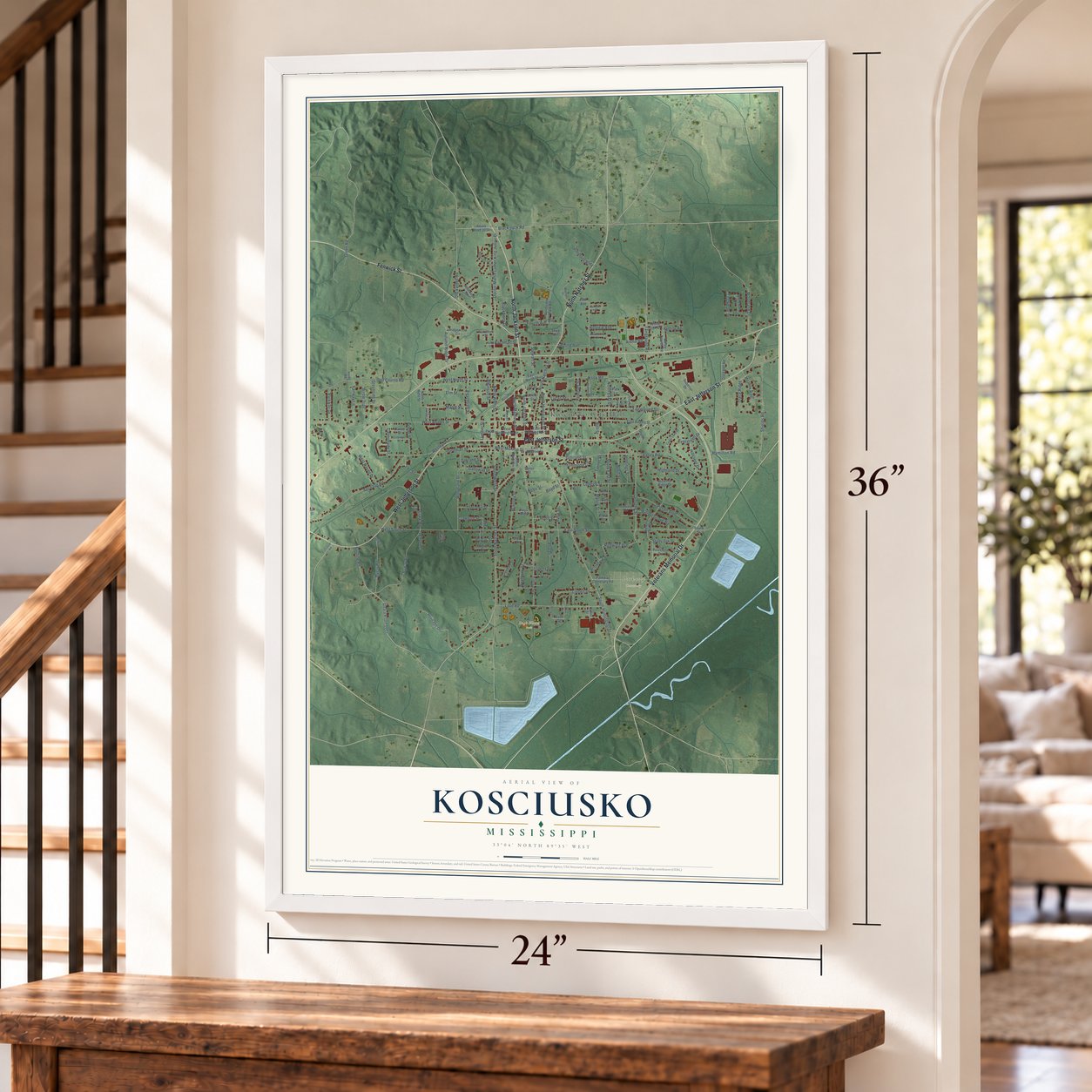Kosciusko, Mississippi map, 24 x 36 inch print in a white frame by a staircase