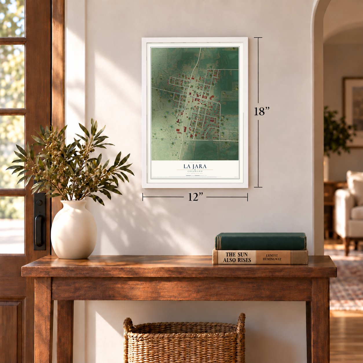 La Jara, Colorado map, 12 x 18 inch print in a white frame in an entryway