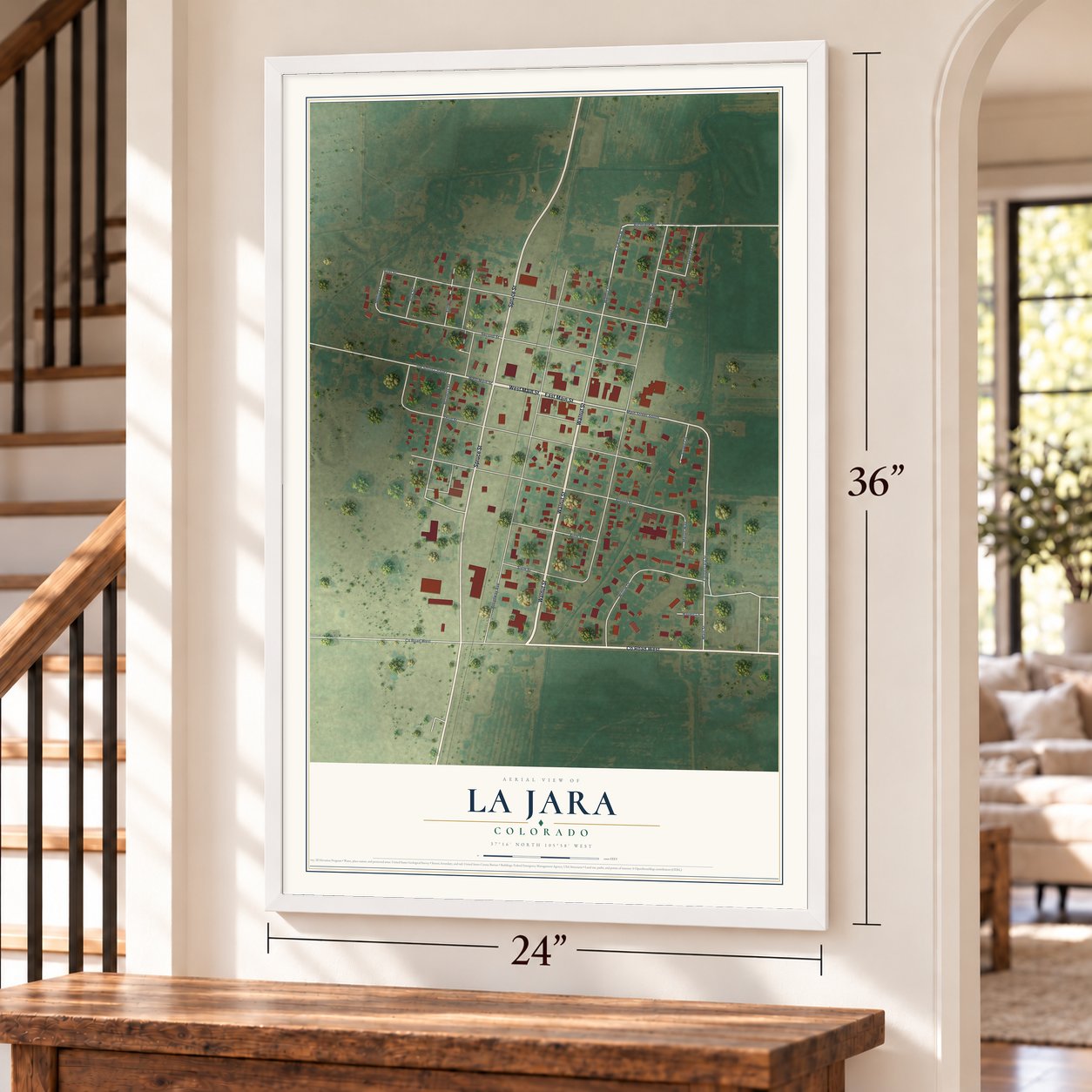 La Jara, Colorado map, 24 x 36 inch print in a white frame by a staircase