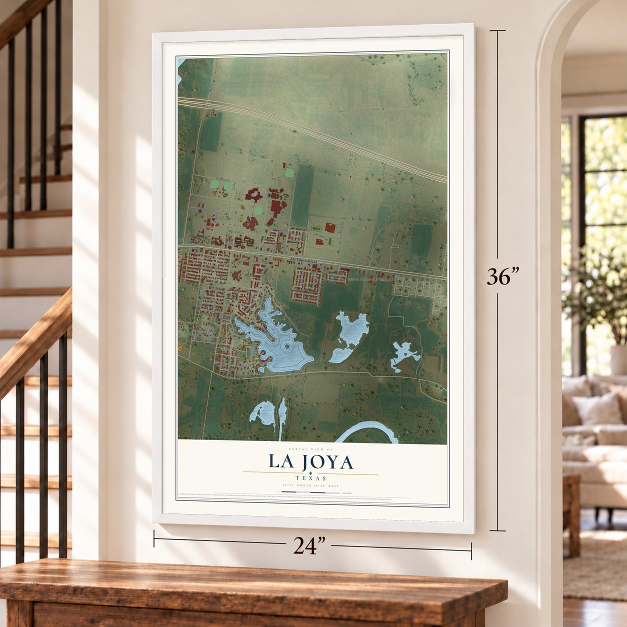 La Joya, Texas map, 24 x 36 inch print in a white frame by a staircase