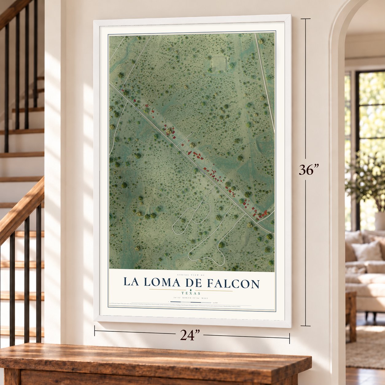 La Loma de Falcon, Texas map, 24 x 36 inch print in a white frame by a staircase