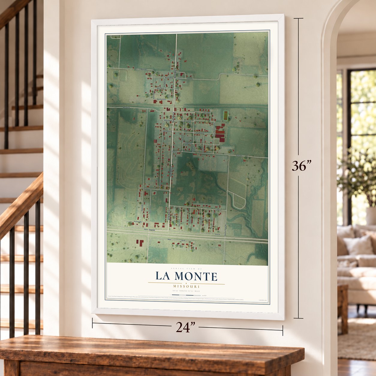 La Monte, Missouri map, 24 x 36 inch print in a white frame by a staircase