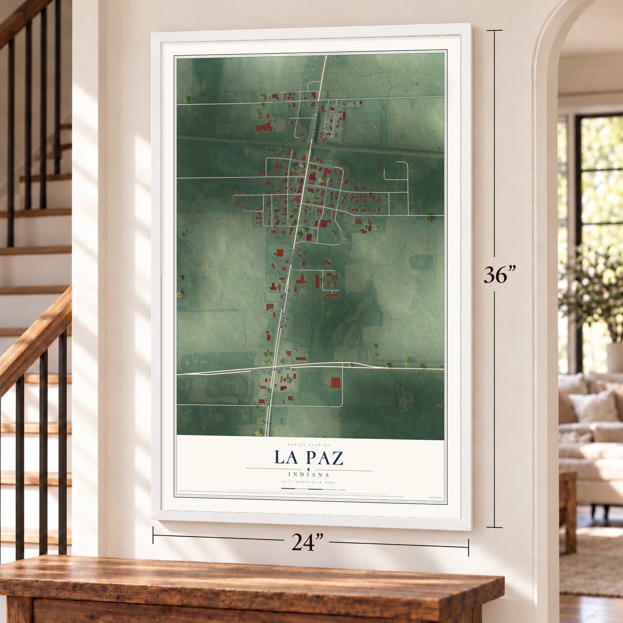La Paz, Indiana map, 24 x 36 inch print in a white frame by a staircase