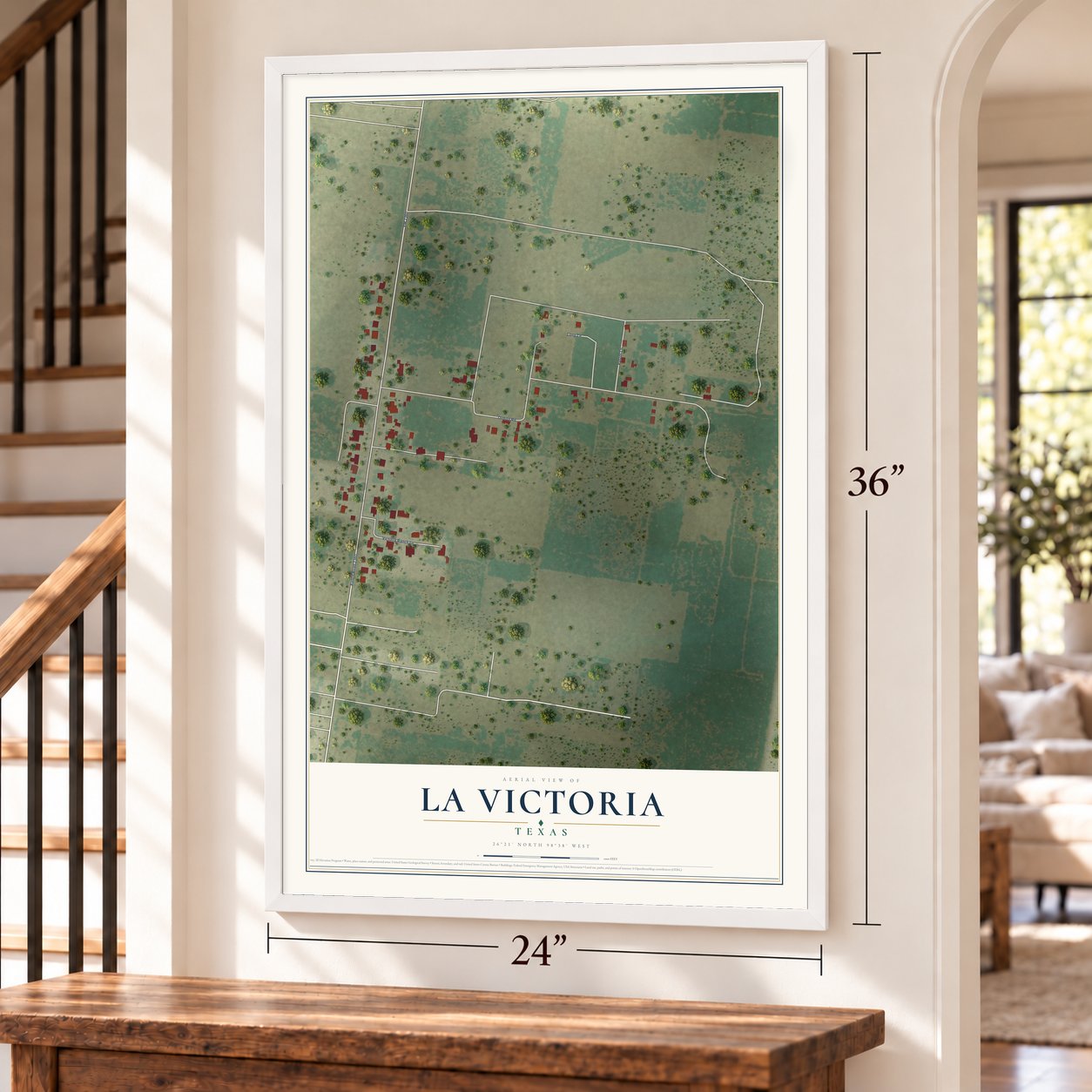 La Victoria, Texas map, 24 x 36 inch print in a white frame by a staircase