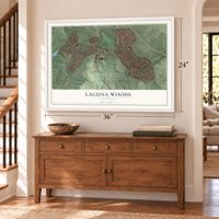 Laguna Woods, California map, 24 x 36 inch print in a white frame above a dresser by a staircase