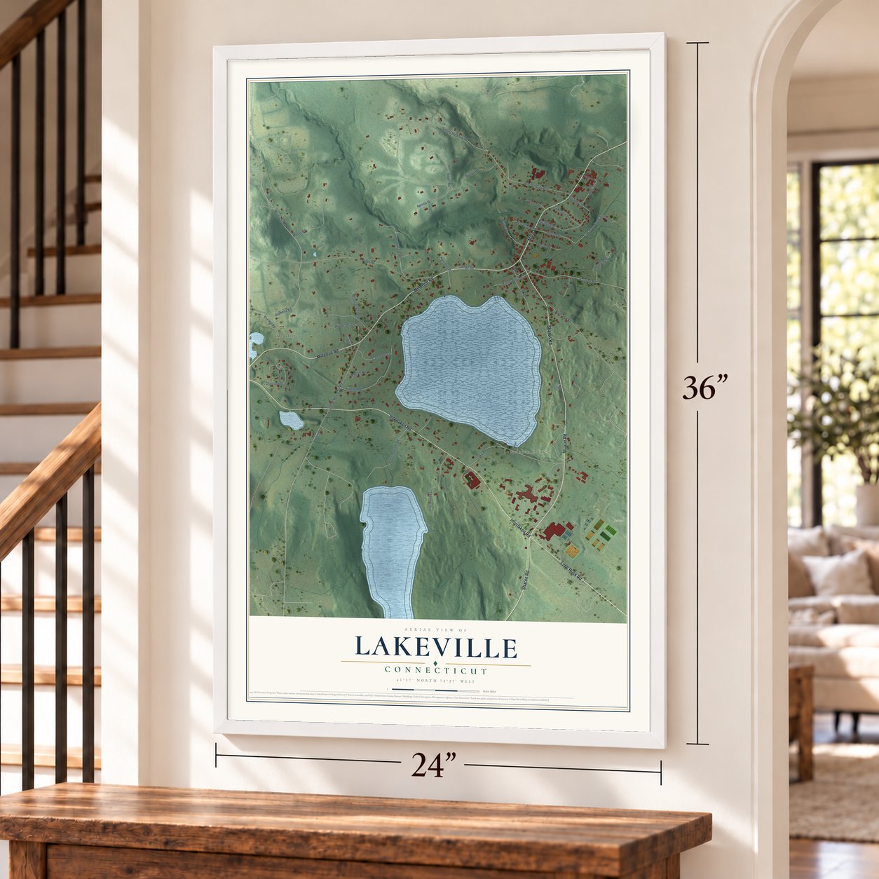 Lakeville, Connecticut map, 24 x 36 inch print in a white frame by a staircase