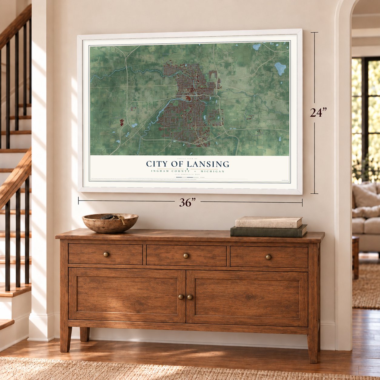 Lansing, Michigan map, 24 x 36 inch print in a white frame above a dresser by a staircase