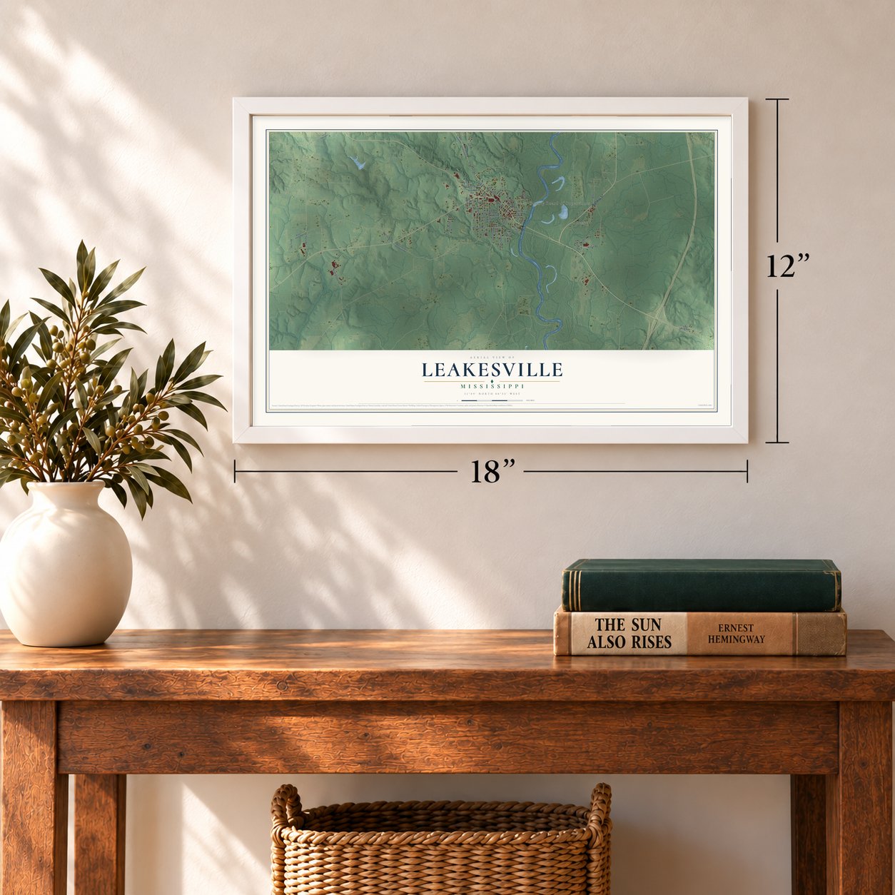 Leakesville, Mississippi map, 12 x 18 inch print in a white frame in an entryway