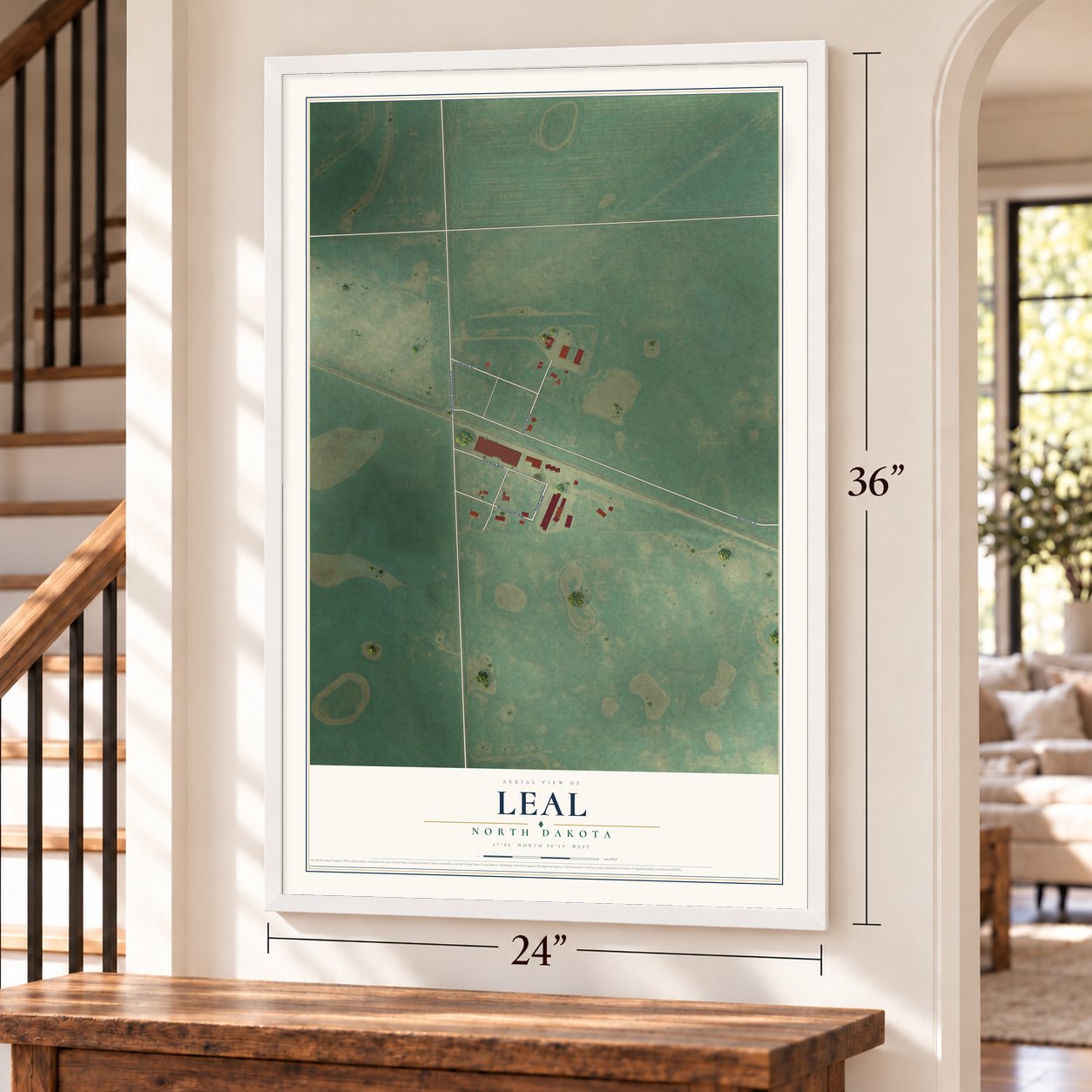 Leal, North Dakota map, 24 x 36 inch print in a white frame by a staircase