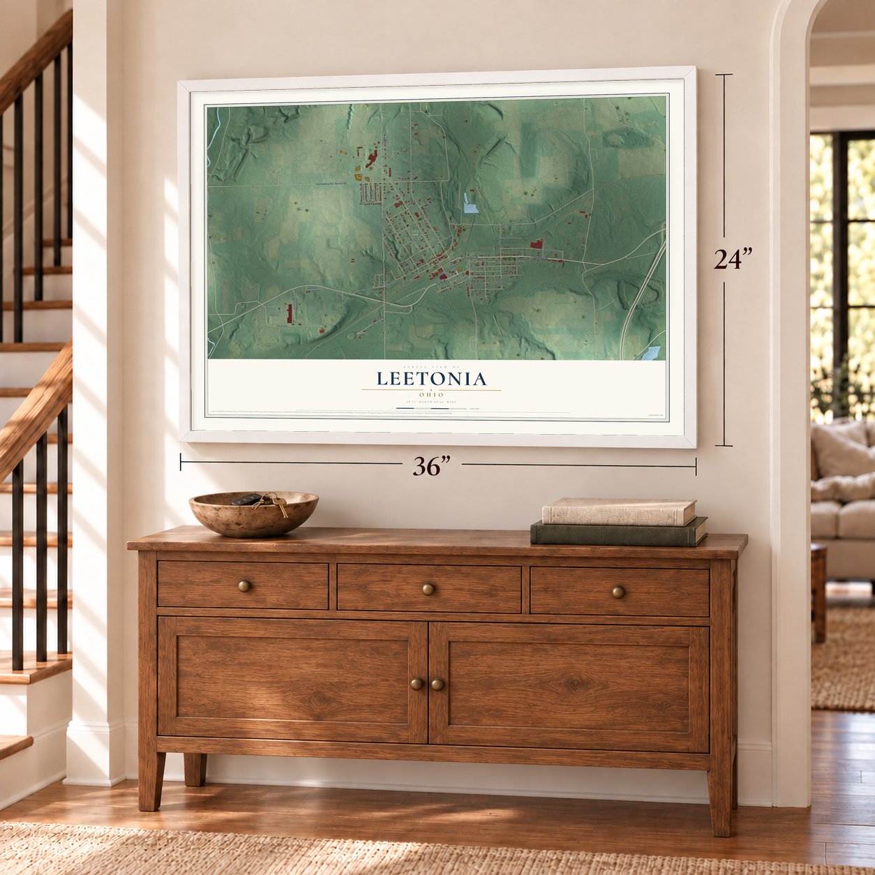 Leetonia, Ohio map, 24 x 36 inch print in a white frame above a dresser by a staircase