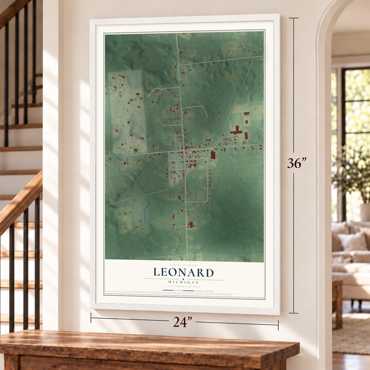 Leonard, Michigan map, 24 x 36 inch print in a white frame by a staircase