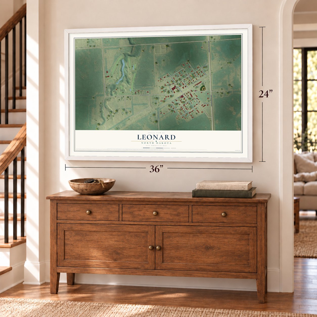 Leonard, North Dakota map, 24 x 36 inch print in a white frame above a dresser by a staircase