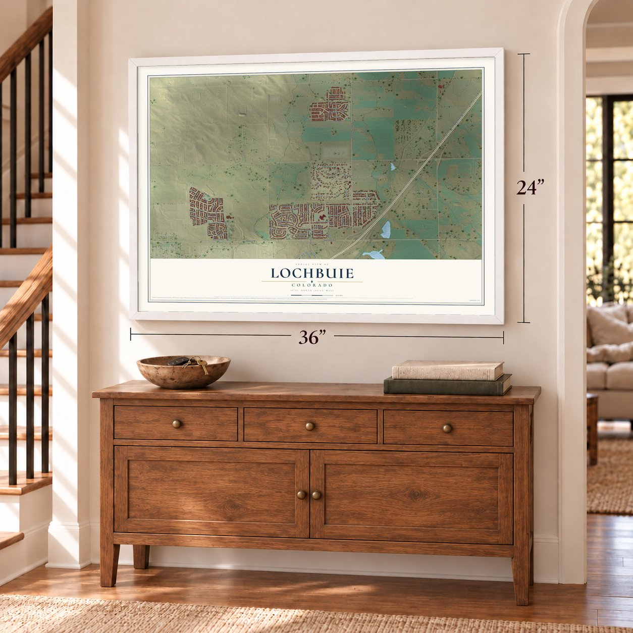 Lochbuie, Colorado map, 24 x 36 inch print in a white frame above a dresser by a staircase
