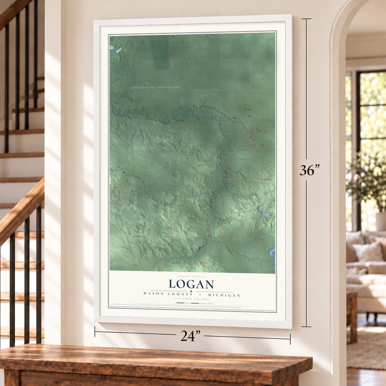 Logan, Mason County, Michigan map, 24 x 36 inch print in a white frame by a staircase