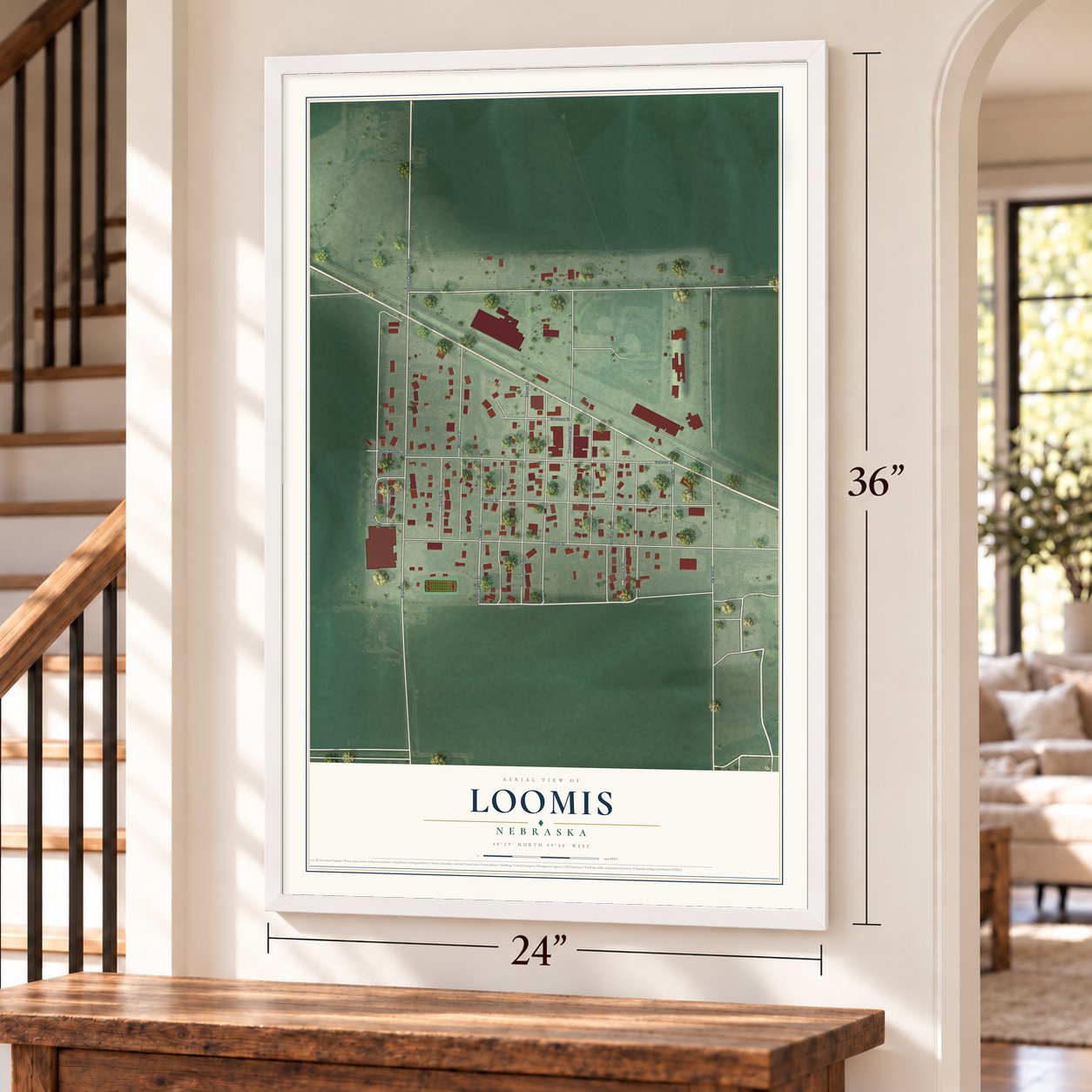 Loomis, Nebraska map, 24 x 36 inch print in a white frame by a staircase