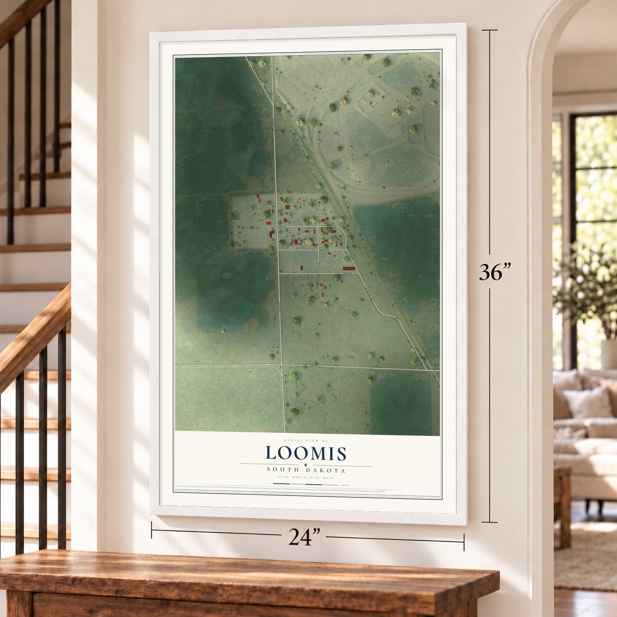 Loomis, South Dakota map, 24 x 36 inch print in a white frame by a staircase