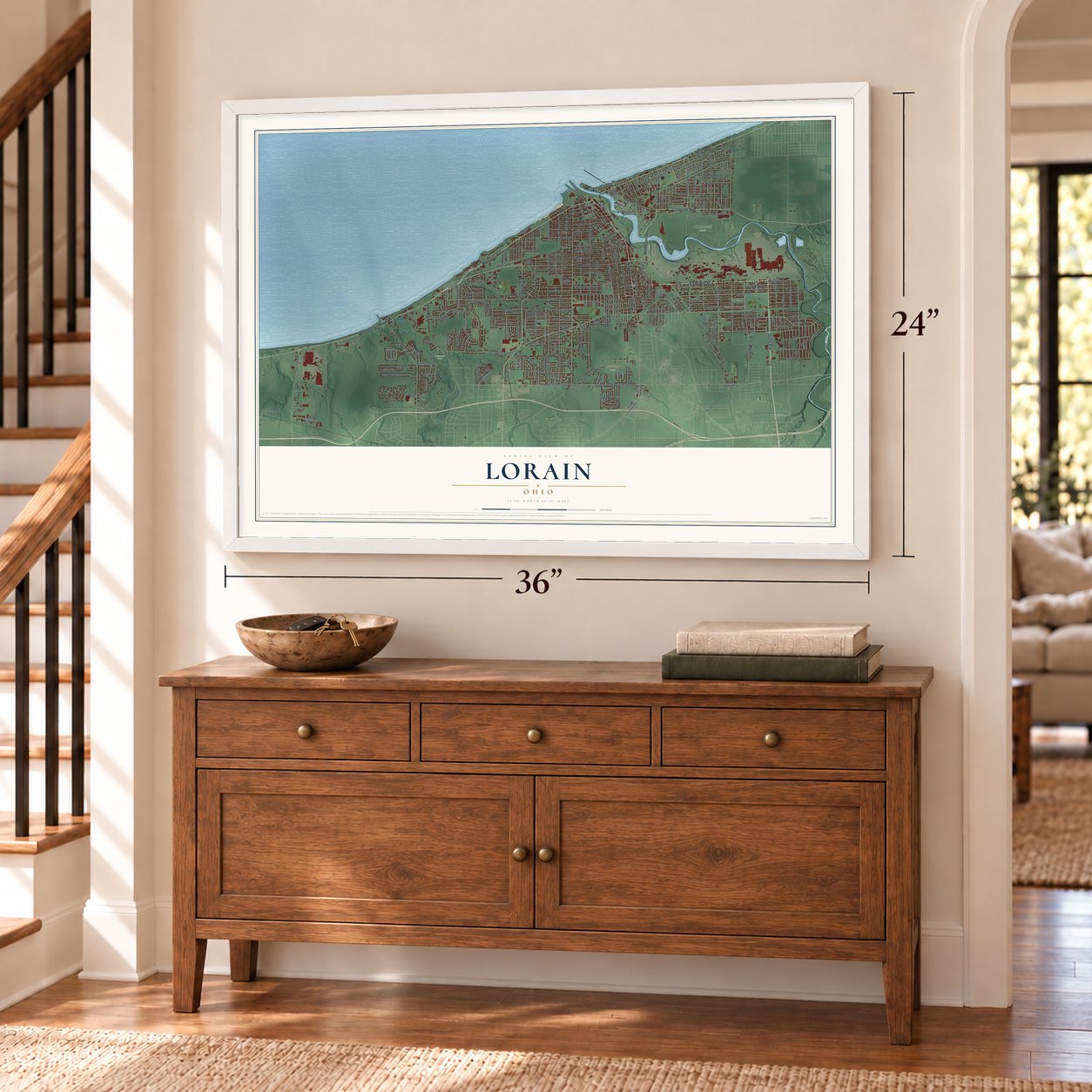 Lorain, Ohio map, 24 x 36 inch print in a white frame above a dresser by a staircase