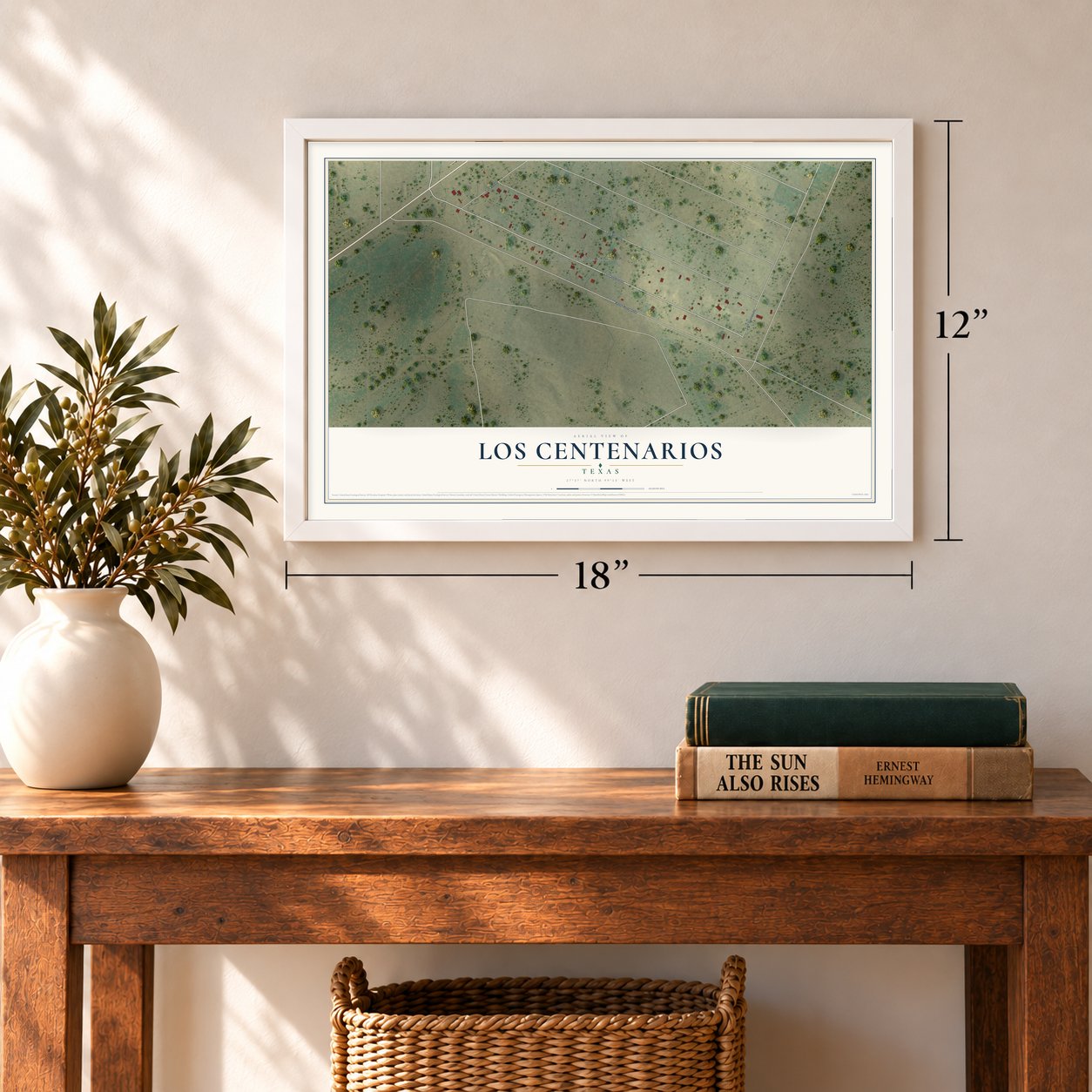 Los Centenarios, Texas map, 12 x 18 inch print in a white frame in an entryway