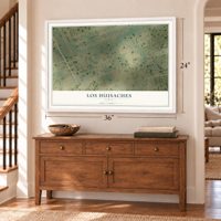 Los Huisaches, Texas map, 24 x 36 inch print in a white frame above a dresser by a staircase