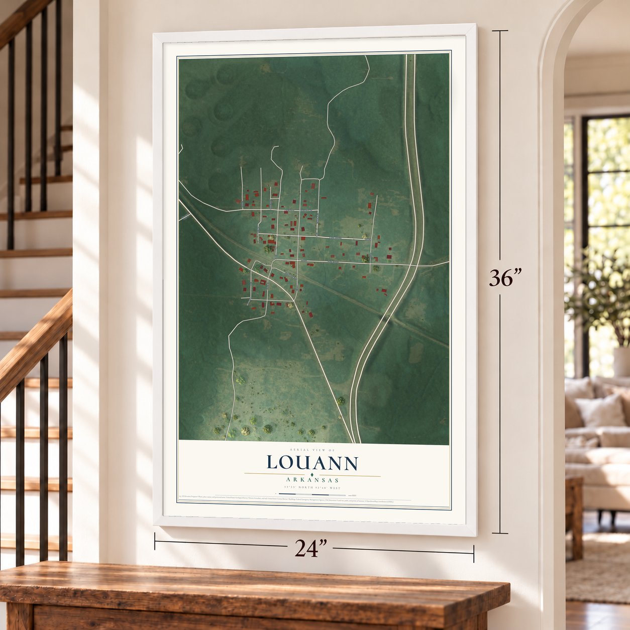 Louann, Arkansas map, 24 x 36 inch print in a white frame by a staircase