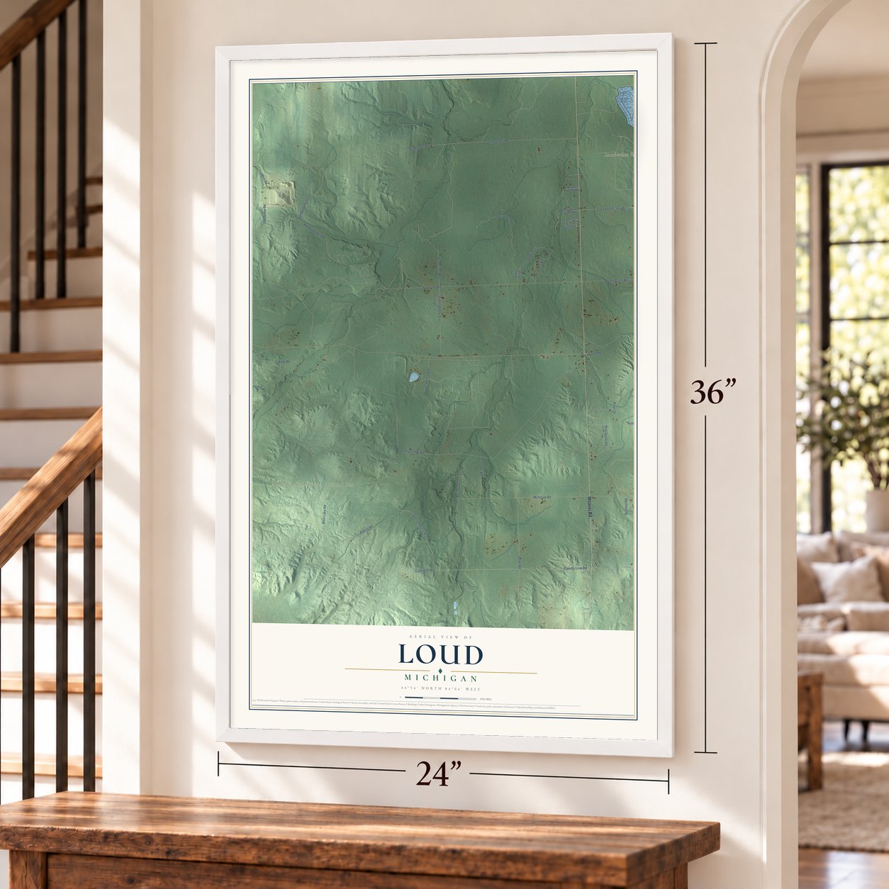 Loud, Michigan map, 24 x 36 inch print in a white frame by a staircase
