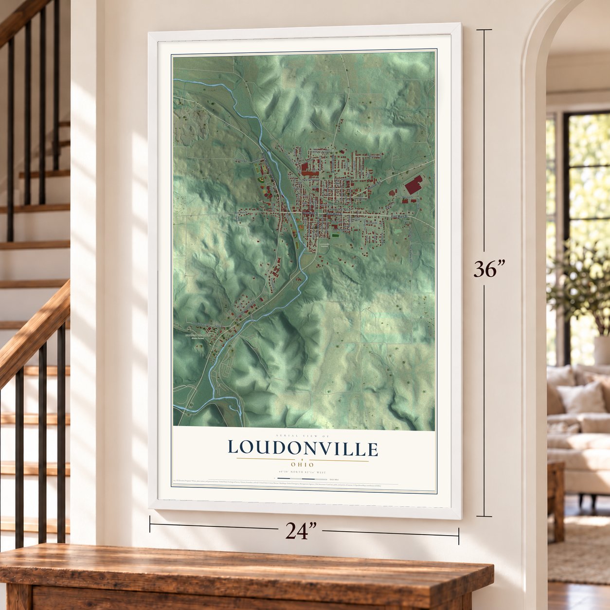 Loudonville, Ohio map, 24 x 36 inch print in a white frame by a staircase
