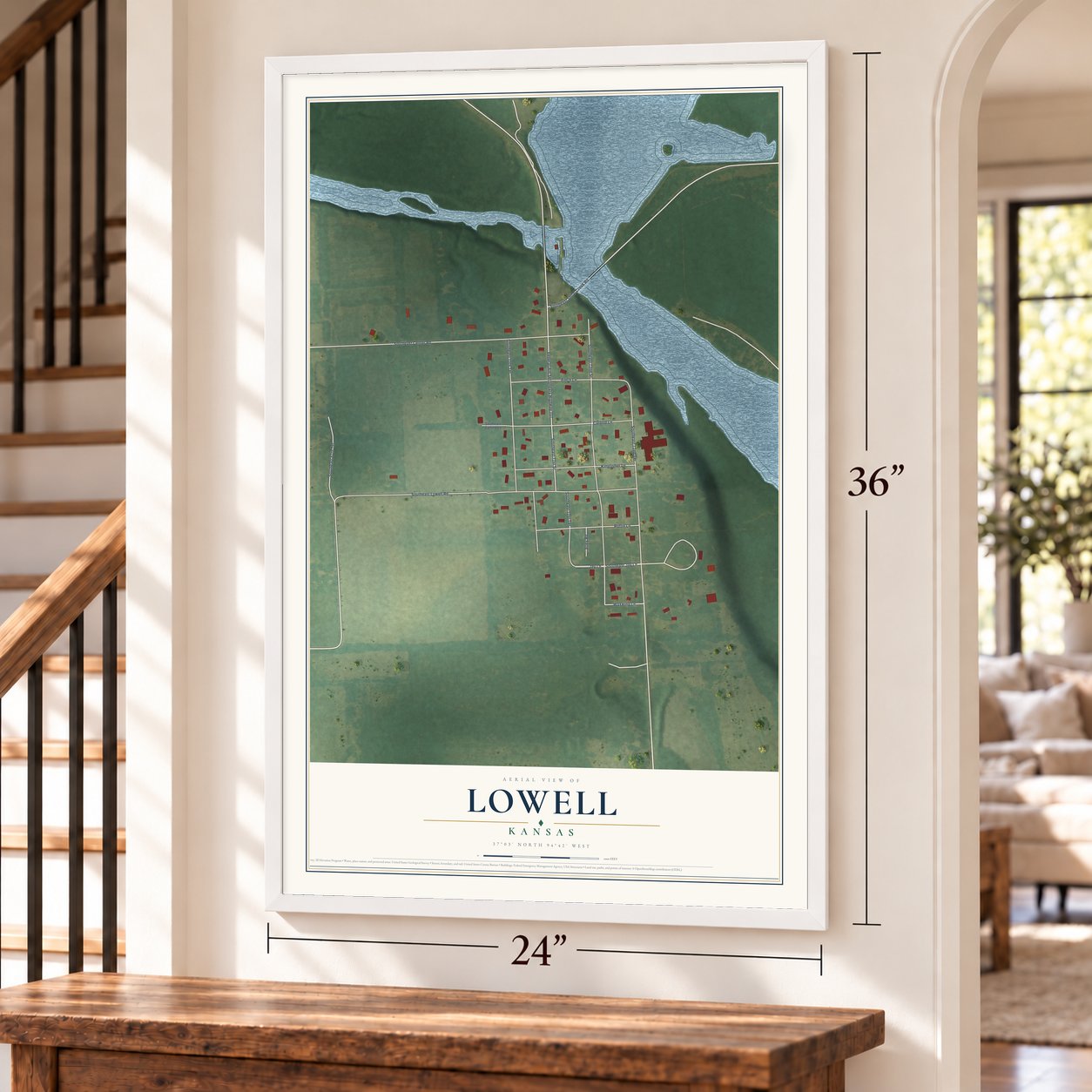 Lowell, Kansas map, 24 x 36 inch print in a white frame by a staircase