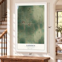 Ludden, North Dakota map, 24 x 36 inch print in a white frame by a staircase