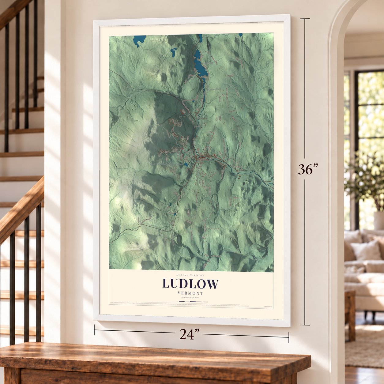 Ludlow, Vermont map, 24 x 36 inch print in a white frame by a staircase