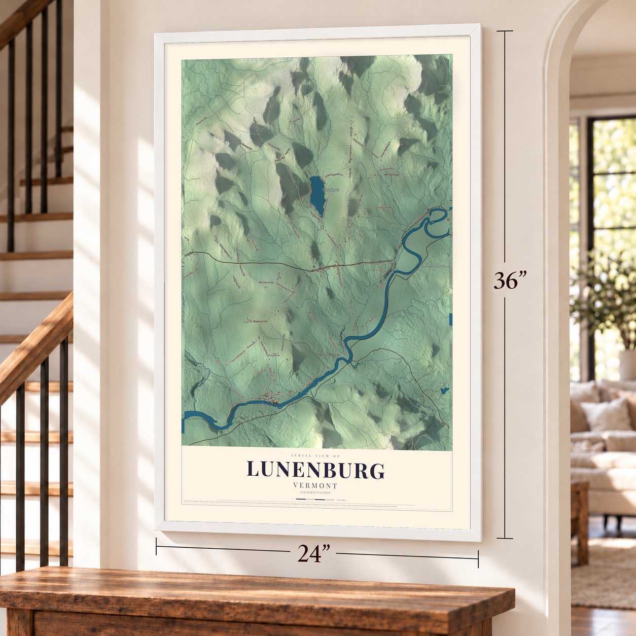 Lunenburg, Vermont map, 24 x 36 inch print in a white frame by a staircase