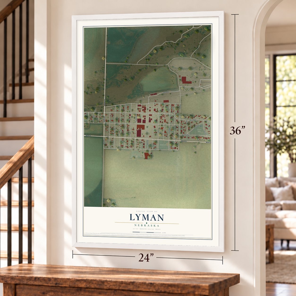 Lyman, Nebraska map, 24 x 36 inch print in a white frame by a staircase
