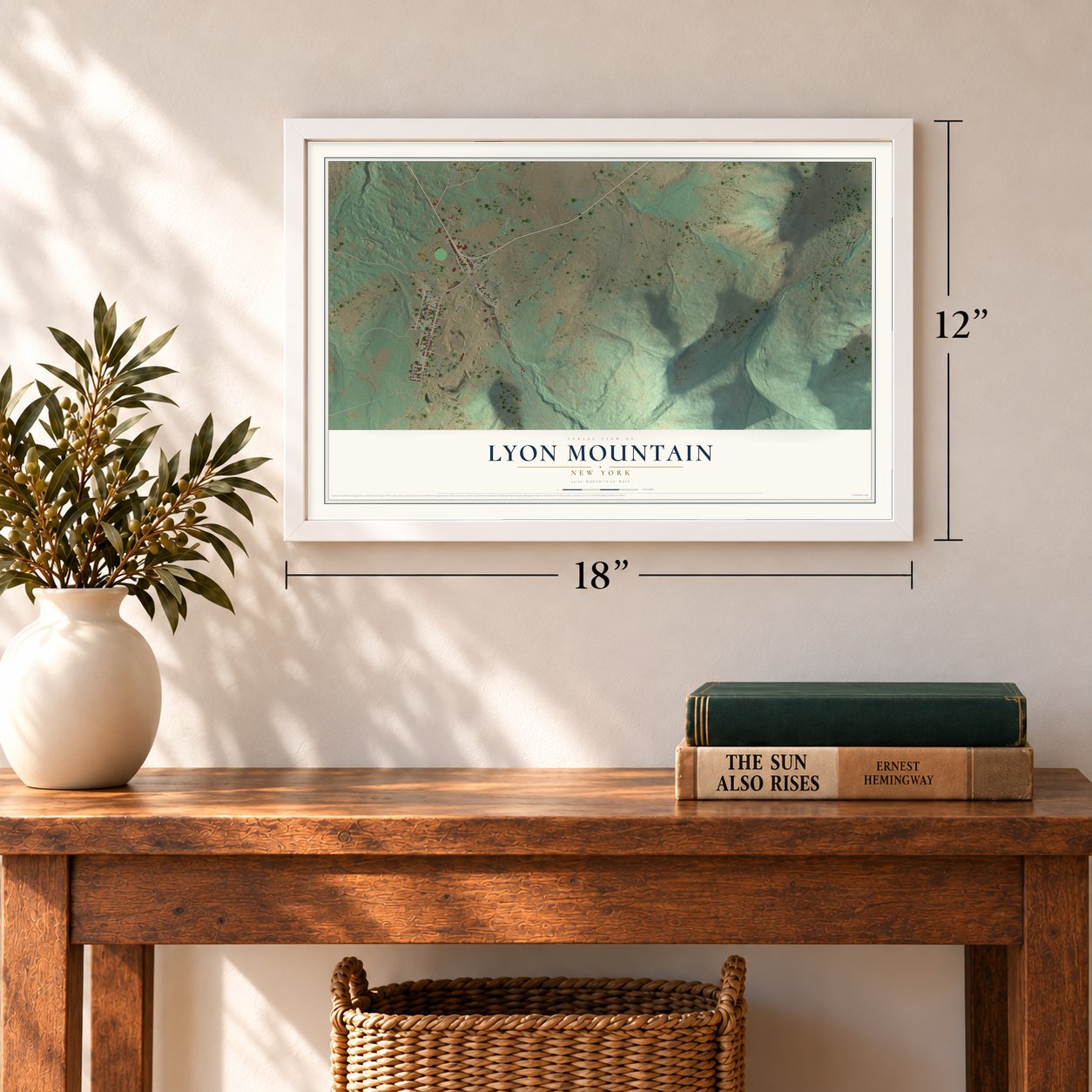 Lyon Mountain, New York map, 12 x 18 inch print in a white frame in an entryway