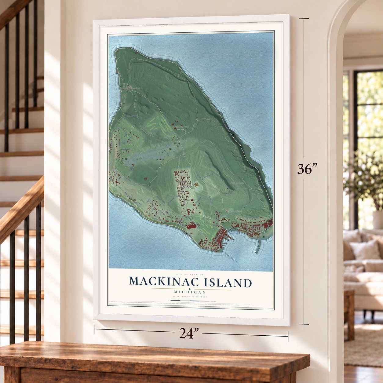 Mackinac Island, Michigan map, 24 x 36 inch print in a white frame by a staircase
