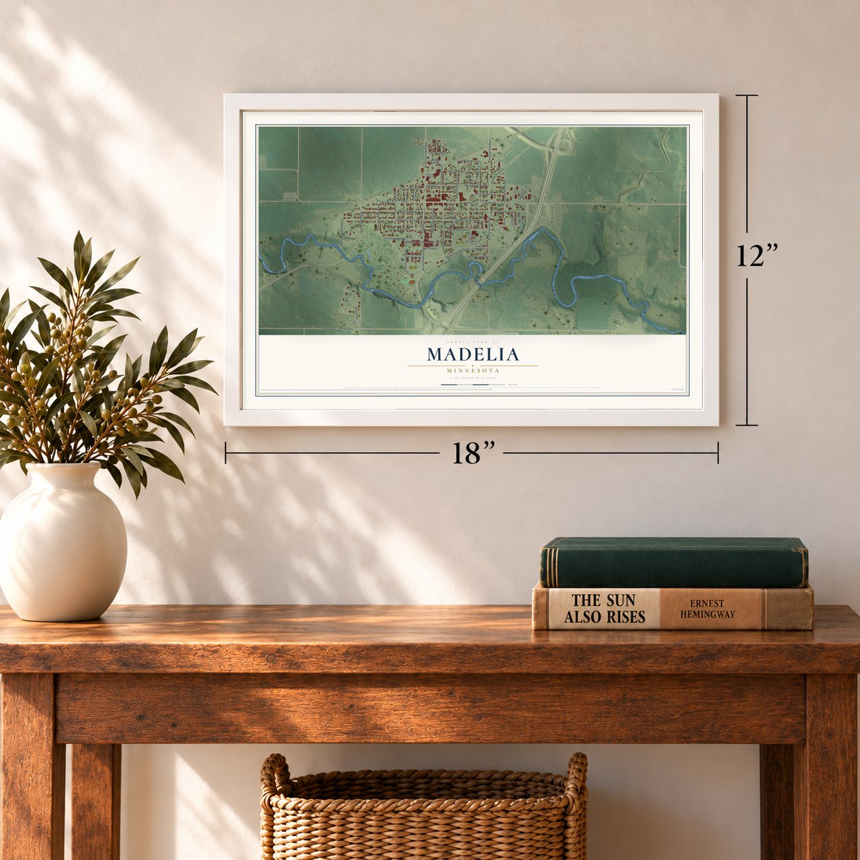 Madelia, Minnesota map, 12 x 18 inch print in a white frame in an entryway