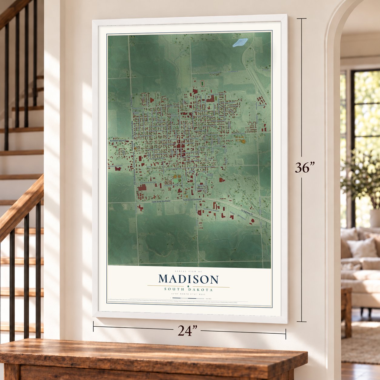Madison, South Dakota map, 24 x 36 inch print in a white frame by a staircase