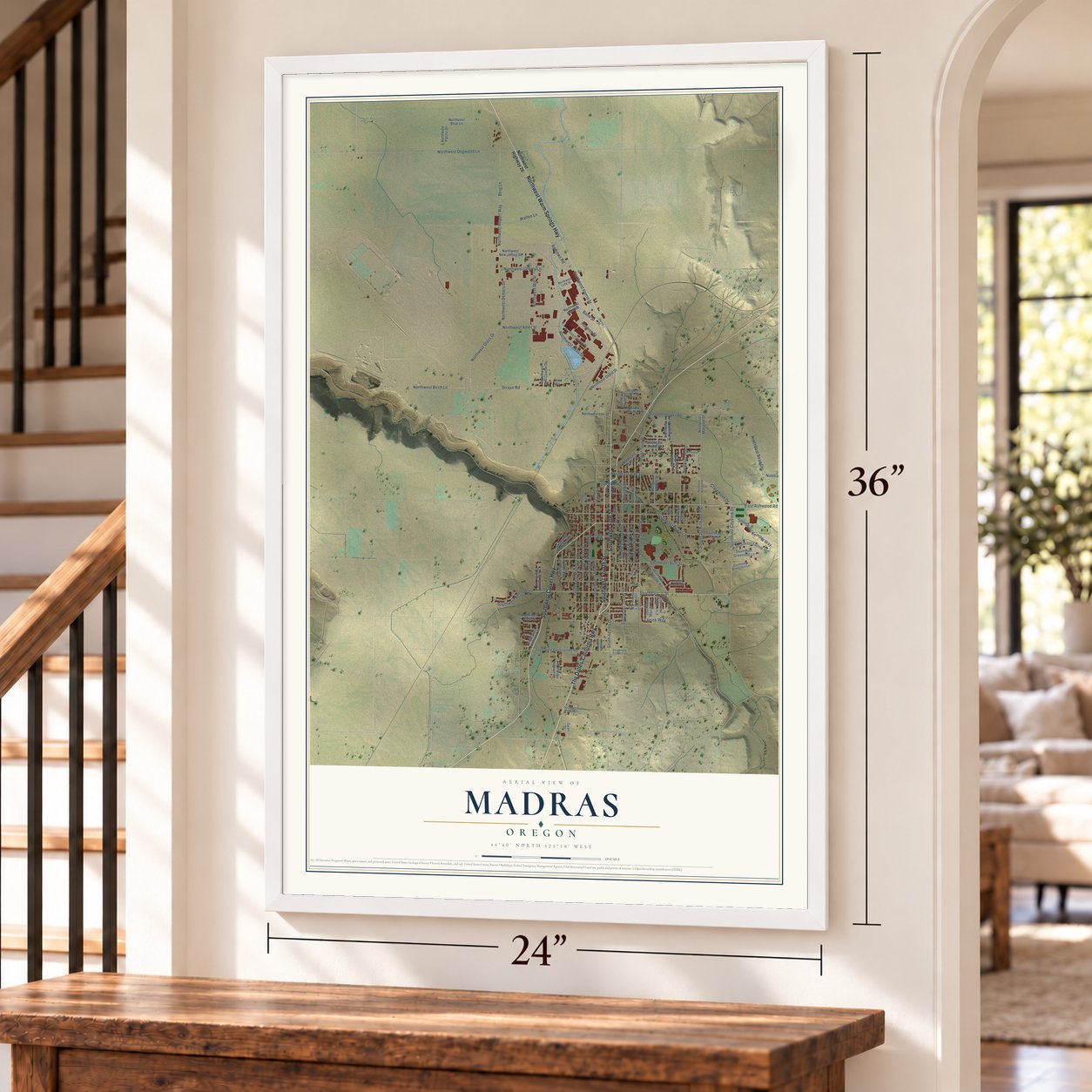 Madras, Oregon map, 24 x 36 inch print in a white frame by a staircase