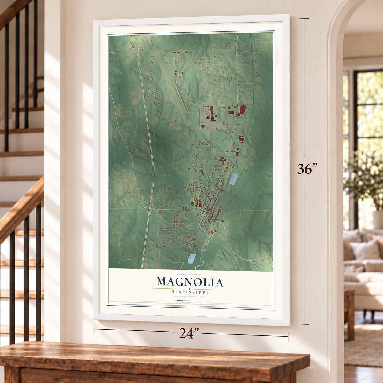 Magnolia, Mississippi map, 24 x 36 inch print in a white frame by a staircase