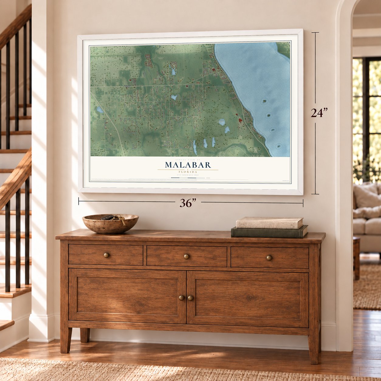 Malabar, Florida map, 24 x 36 inch print in a white frame above a dresser by a staircase