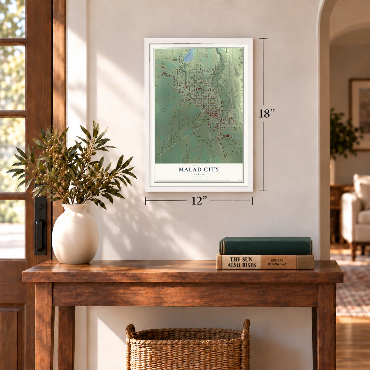 Malad City, Idaho map, 12 x 18 inch print in a white frame in an entryway