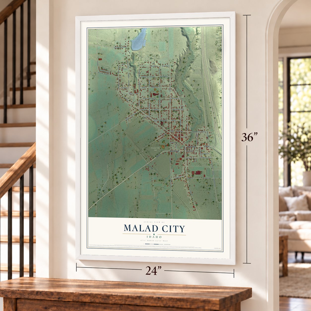 Malad City, Idaho map, 24 x 36 inch print in a white frame by a staircase