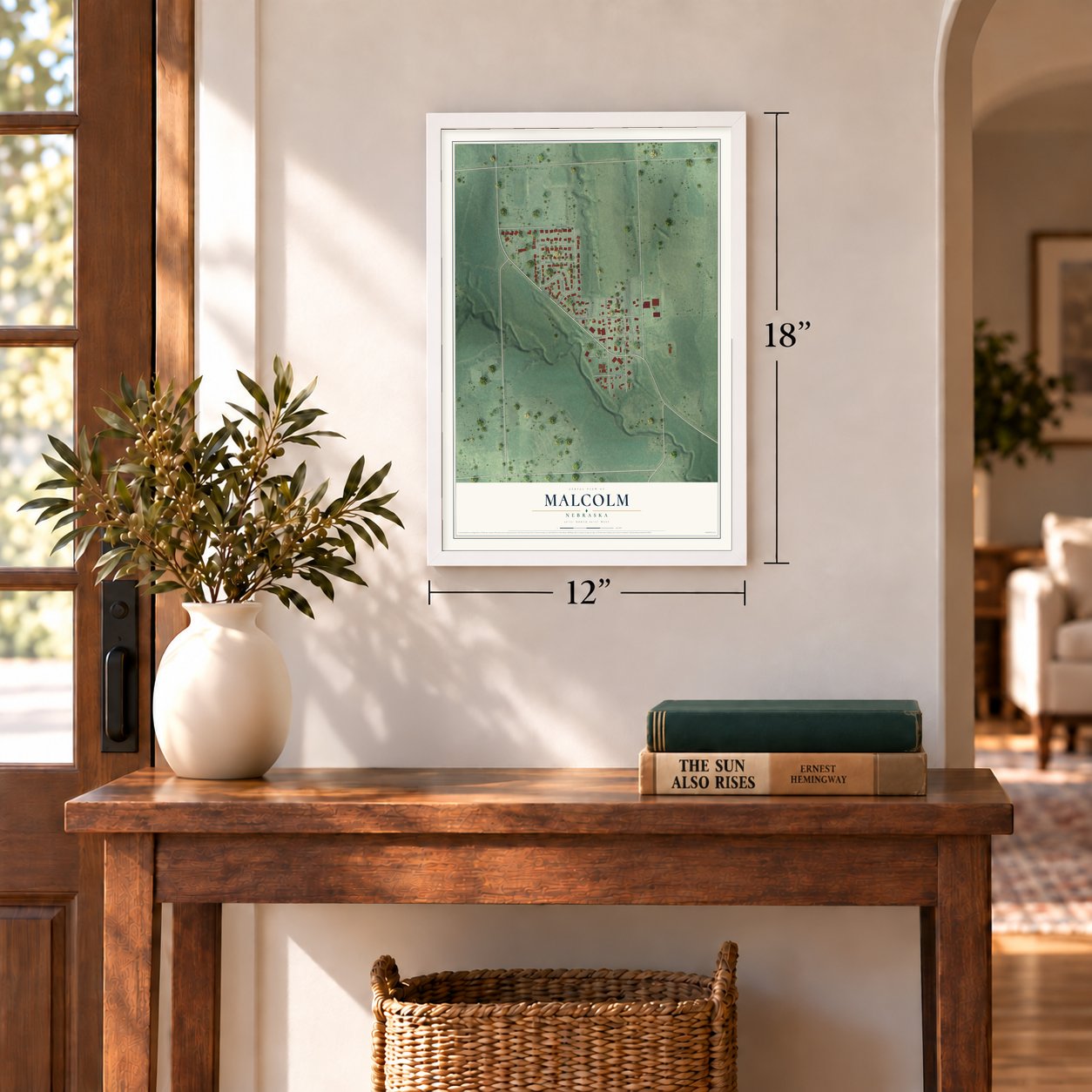 Malcolm, Nebraska map, 12 x 18 inch print in a white frame in an entryway