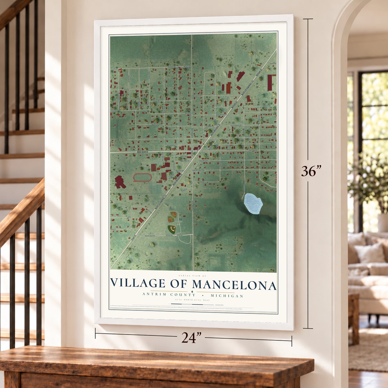 Mancelona, Michigan map, 24 x 36 inch print in a white frame by a staircase