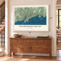 Manchester-by-the-Sea, Massachusetts map, 24 x 36 inch print in a white frame above a dresser by a staircase