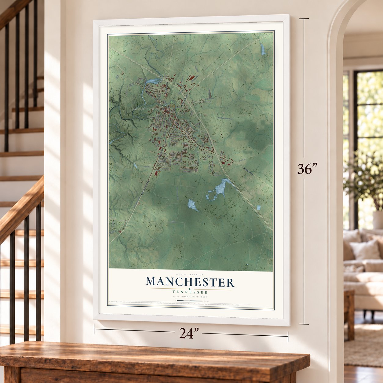 Manchester, Tennessee map, 24 x 36 inch print in a white frame by a staircase