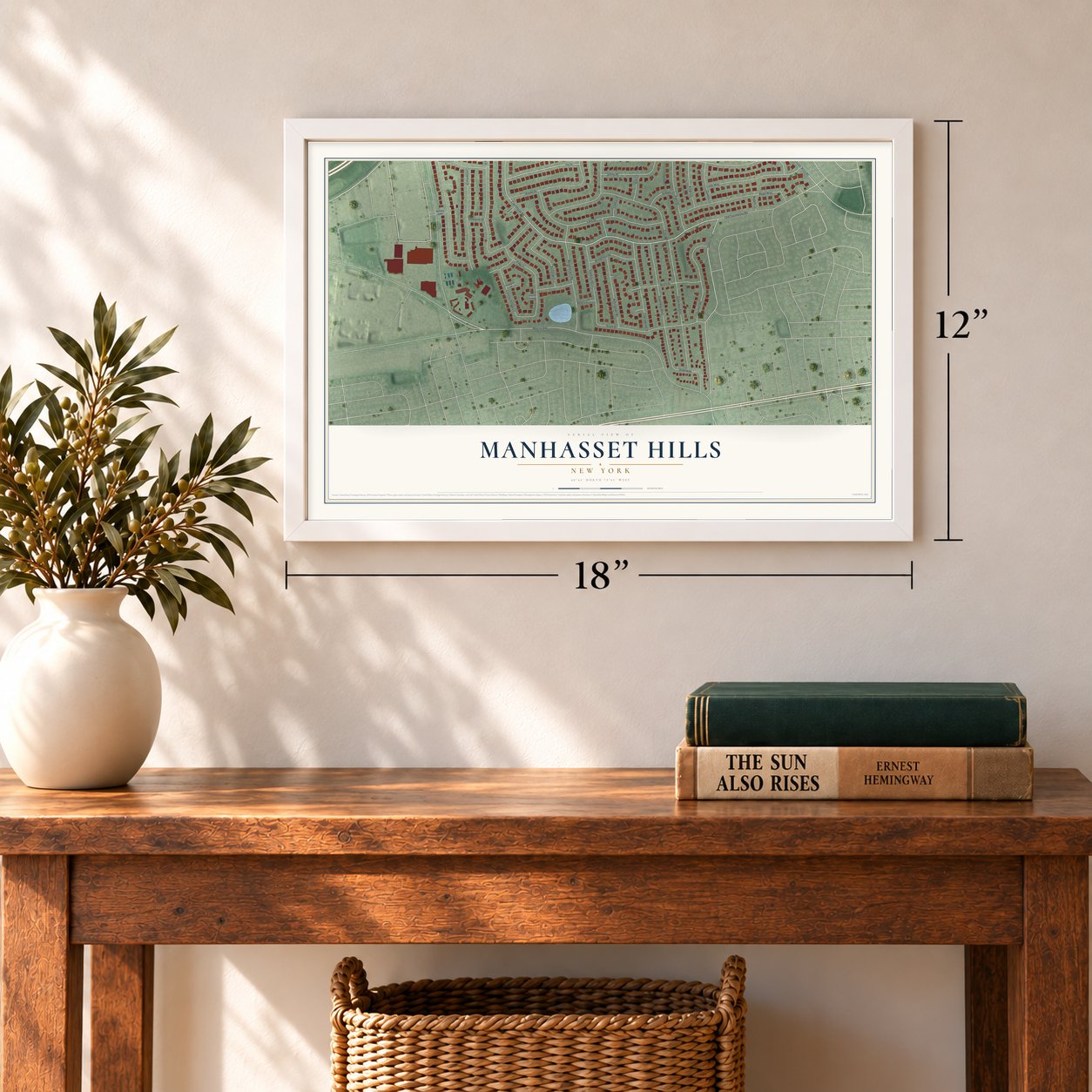 Manhasset Hills, New York map, 12 x 18 inch print in a white frame in an entryway