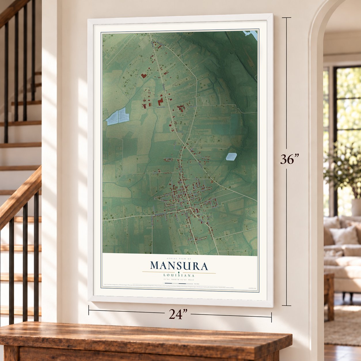 Mansura, Louisiana map, 24 x 36 inch print in a white frame by a staircase