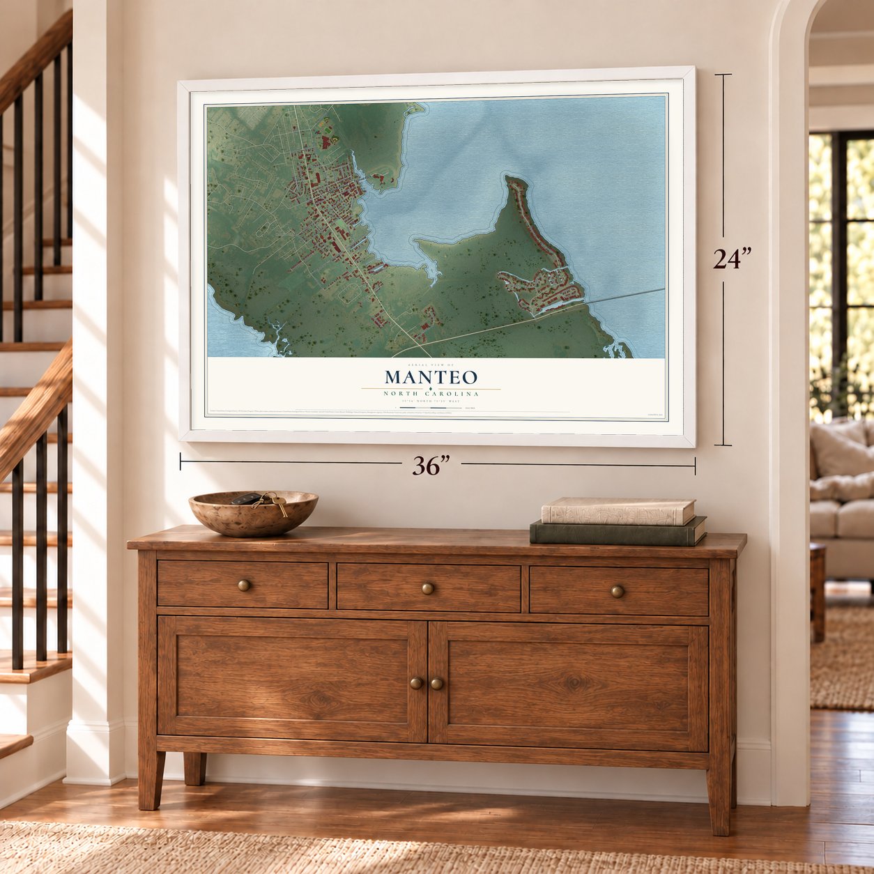 Manteo, North Carolina map, 24 x 36 inch print in a white frame above a dresser by a staircase