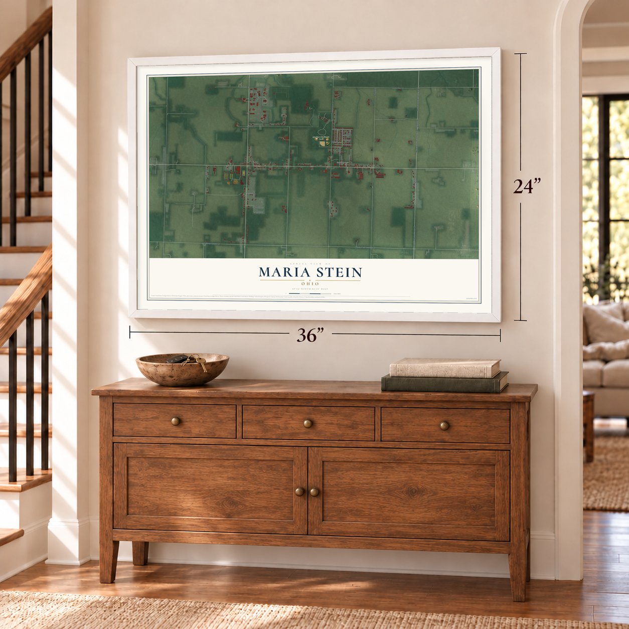 Maria Stein, Ohio map, 24 x 36 inch print in a white frame above a dresser by a staircase