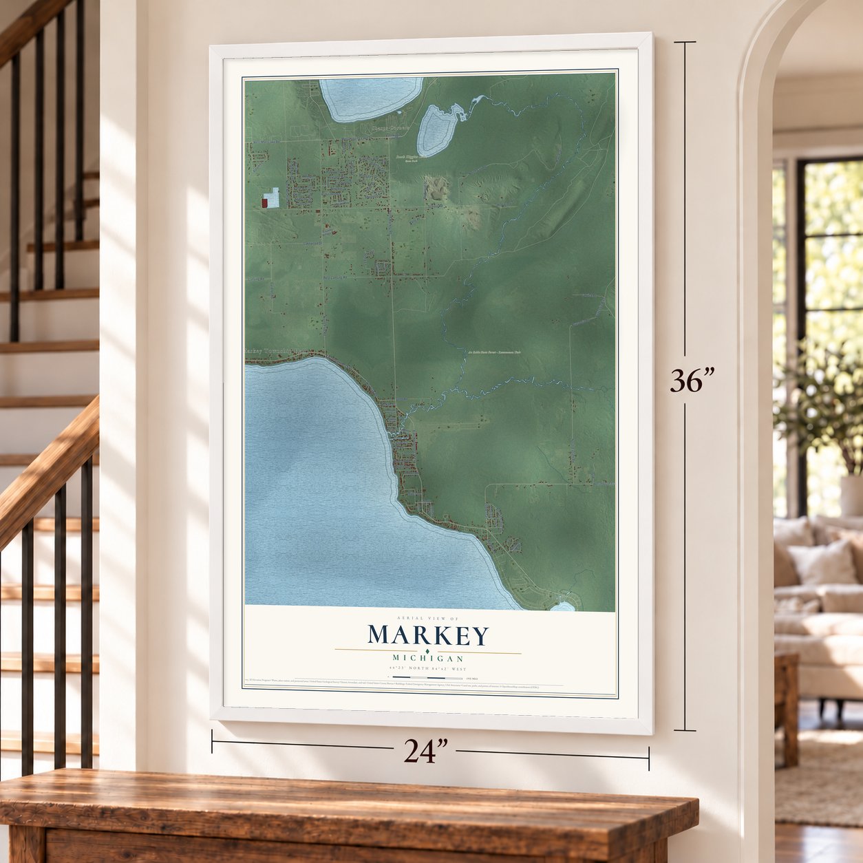 Markey, Michigan map, 24 x 36 inch print in a white frame by a staircase