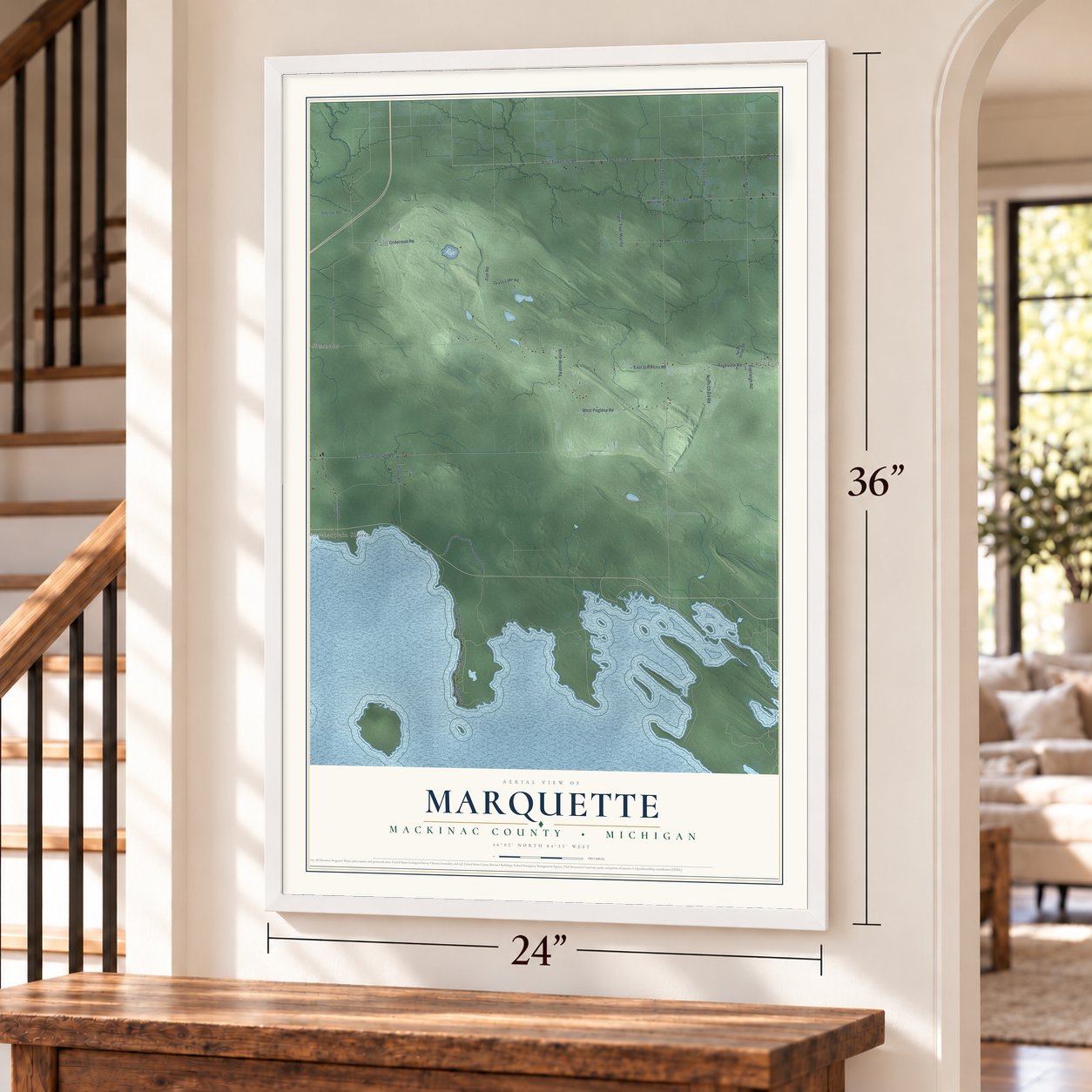 Marquette, Mackinac County, Michigan map, 24 x 36 inch print in a white frame by a staircase
